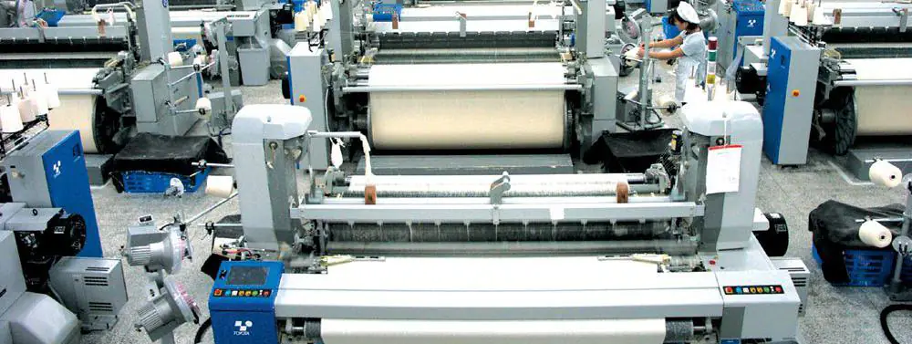 Air-jet looms weaving white fabric